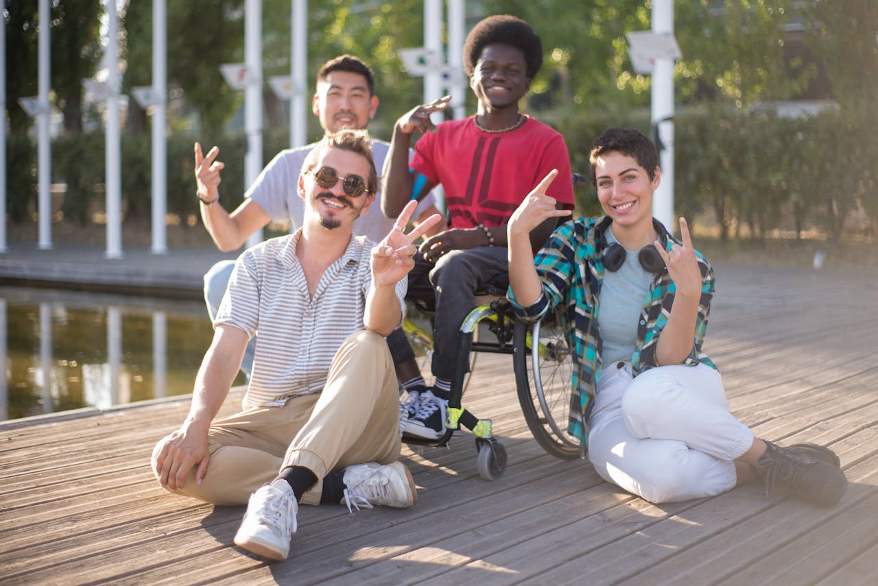 Crafting Captivating Headlines: Your awesome post title goes here Smiling diverse friends sitting outdoors with wheelchair, celebrating diversity and friendship.